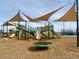 Another view of the community playground with various play equipment and shade structures at 22961 E Twin Acres Dr, Queen Creek, AZ 85142