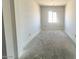 Neutral room with window awaiting finishing touches, ready for you to make it your own at 22961 E Twin Acres Dr, Queen Creek, AZ 85142