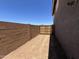 Narrow side yard with block wall and gate for access at 22961 E Twin Acres Dr, Queen Creek, AZ 85142