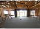 Open unfinished space showcasing wood framing, large windows and a large sliding glass door at 22961 E Twin Acres Dr, Queen Creek, AZ 85142