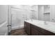 Bright bathroom featuring a double sink vanity, spacious shower, and modern fixtures at 24577 W St Anne Ave, Buckeye, AZ 85326