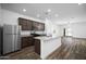 Modern kitchen featuring stainless steel appliances and granite countertops at 24577 W St Anne Ave, Buckeye, AZ 85326