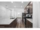 Bright kitchen boasts stainless steel appliances and granite countertops at 24577 W St Anne Ave, Buckeye, AZ 85326