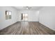 Spacious living room with sliding glass doors and wood-look floors at 24577 W St Anne Ave, Buckeye, AZ 85326