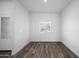 Bright and airy living room with wood-look flooring at 24577 W St Anne Ave, Buckeye, AZ 85326