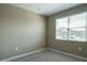 Bedroom with carpet flooring, neutral walls, window allowing lots of natural light, and electrical outlets at 2480 S 241St Ave, Buckeye, AZ 85326