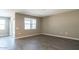 Bright bedroom with wood-look tile flooring, slider to the backyard, and natural light at 2480 S 241St Ave, Buckeye, AZ 85326