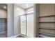 Walk-in shower with a sliding glass door and neutral decor at 2480 S 241St Ave, Buckeye, AZ 85326