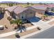 Elevated view of a house in a neighborhood, featuring desert landscaping and golf course views at 2643 E San Ricardo Trl, Casa Grande, AZ 85194