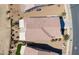 Aerial view of a home's roof, desert landscaping, a strip of turf, and a patio cover at 2643 E San Ricardo Trl, Casa Grande, AZ 85194
