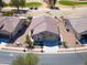 Elevated view of a house in a neighborhood next to a golf course at 2643 E San Ricardo Trl, Casa Grande, AZ 85194