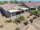 Aerial view of a home with a covered patio, desert landscaping, and a pathway at 2643 E San Ricardo Trl, Casa Grande, AZ 85194
