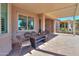 Charming covered patio featuring brick pavers, neutral colors, and a beautiful outdoor space at 2643 E San Ricardo Trl, Casa Grande, AZ 85194