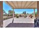 A covered back patio with brick pavers, fireplace, and beautiful views at 2643 E San Ricardo Trl, Casa Grande, AZ 85194