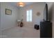 Bedroom with carpeted floors, natural light, guitar and music stand at 2643 E San Ricardo Trl, Casa Grande, AZ 85194