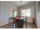 Dining area features a table and chairs with access to the outdoor patio seating area at 2643 E San Ricardo Trl, Casa Grande, AZ 85194