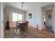 Bright dining area with a window, stylish lighting, and wood-look flooring at 2643 E San Ricardo Trl, Casa Grande, AZ 85194