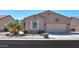 Charming single-story home with desert landscaping, tan stucco, and attached two-car garage at 2643 E San Ricardo Trl, Casa Grande, AZ 85194