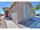 Exterior showcasing the front door with a paver walkway and desert landscaping with mature plants at 2643 E San Ricardo Trl, Casa Grande, AZ 85194