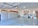 Clean and organized three car garage features painted floor and plenty of storage at 2643 E San Ricardo Trl, Casa Grande, AZ 85194