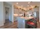 A well-appointed kitchen boasts a large island with seating, stainless steel appliances, and ample storage at 2643 E San Ricardo Trl, Casa Grande, AZ 85194