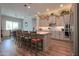 Spacious kitchen features a large island with seating, stainless steel appliances, and grey cabinets at 2643 E San Ricardo Trl, Casa Grande, AZ 85194