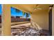 View of the covered patio with ceiling fan overlooking the back yard at 2725 W Silver Creek Ln, San Tan Valley, AZ 85144