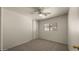 Clean bedroom features a large window, neutral colors, and a closet with sliding doors at 2725 W Silver Creek Ln, San Tan Valley, AZ 85144