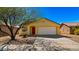 Charming single-story home with a well-manicured yard, desert landscaping, and a red front door at 2725 W Silver Creek Ln, San Tan Valley, AZ 85144