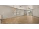 Large living space with tile floors, a chandelier, and sliding door to backyard at 2725 W Silver Creek Ln, San Tan Valley, AZ 85144