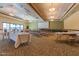 Spacious meeting room with a projector screen, tables, and chairs for community events at 2725 W Silver Creek Ln, San Tan Valley, AZ 85144