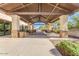 Outdoor pavilion featuring stone pillars, ceiling fans, and tables for residents' enjoyment at 2725 W Silver Creek Ln, San Tan Valley, AZ 85144