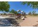 A colorful playground with a slide, climbing structures, and a covered picnic area at 2725 W Silver Creek Ln, San Tan Valley, AZ 85144