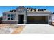 Unfinished exterior of a home under construction with stucco and dark roofing tiles at 28200 N Nealite Dr, San Tan Valley, AZ 85143