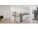Bright and open kitchen featuring an island with seating, modern appliances, and a seamless connection to living spaces at 28200 N Nealite Dr, San Tan Valley, AZ 85143