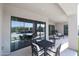 Back patio area perfect for entertaining featuring a table and chairs, and sliding glass doors at 28282 N 158Th St, Scottsdale, AZ 85262