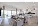 Open-concept living room with view to kitchen and outdoor area at 28282 N 158Th St, Scottsdale, AZ 85262