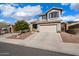 Charming two-story home featuring a well-maintained front yard, two-car garage and desert landscaping at 3734 W Blue Eagle Ct, Phoenix, AZ 85086