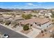 Charming two-story home boasts a desert landscape, tile roof, and mountain views at 3734 W Blue Eagle Ct, Phoenix, AZ 85086