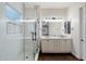 Modern bathroom with glass shower, white subway tile, and double sink vanity at 4088 E Comstock Dr, Gilbert, AZ 85296