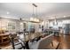 Spacious living area with comfortable seating and an open layout flowing into the dining and kitchen spaces at 4088 E Comstock Dr, Gilbert, AZ 85296