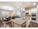 Open floor plan showcases the kitchen island with views of the dining and living areas at 4088 E Comstock Dr, Gilbert, AZ 85296