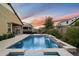 Inviting backyard with a pool, integrated spa, and serene water feature for ultimate relaxation at 4088 E Comstock Dr, Gilbert, AZ 85296