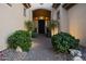 Inviting front entrance featuring manicured landscaping and a charming brick walkway at 41711 N Pinion Hills Ct, Anthem, AZ 85086