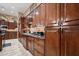 A kitchen with custom wood cabinetry and granite countertops at 41711 N Pinion Hills Ct, Anthem, AZ 85086