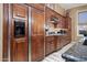 Kitchen showcasing custom cabinetry, granite counters, and stainless steel appliances at 41711 N Pinion Hills Ct, Anthem, AZ 85086