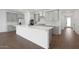 Contemporary kitchen with white countertops, gray cabinetry, a large island, and stainless steel appliances at 4238 W Brenley Dr, San Tan Valley, AZ 85144