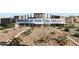 Welcoming entrance to Pinnacle at San Tan Heights, showcasing mature landscaping, and a stone accented sign at 4241 W Brenley Dr, San Tan Valley, AZ 85144