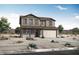 Traditional two-story home featuring a neutral color palette, covered porch, and a two car garage at 4241 W Brenley Dr, San Tan Valley, AZ 85144