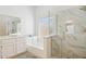 Modern bathroom featuring a glass-enclosed shower and a separate soaking tub at 4936 E Villa Rita Dr, Scottsdale, AZ 85254